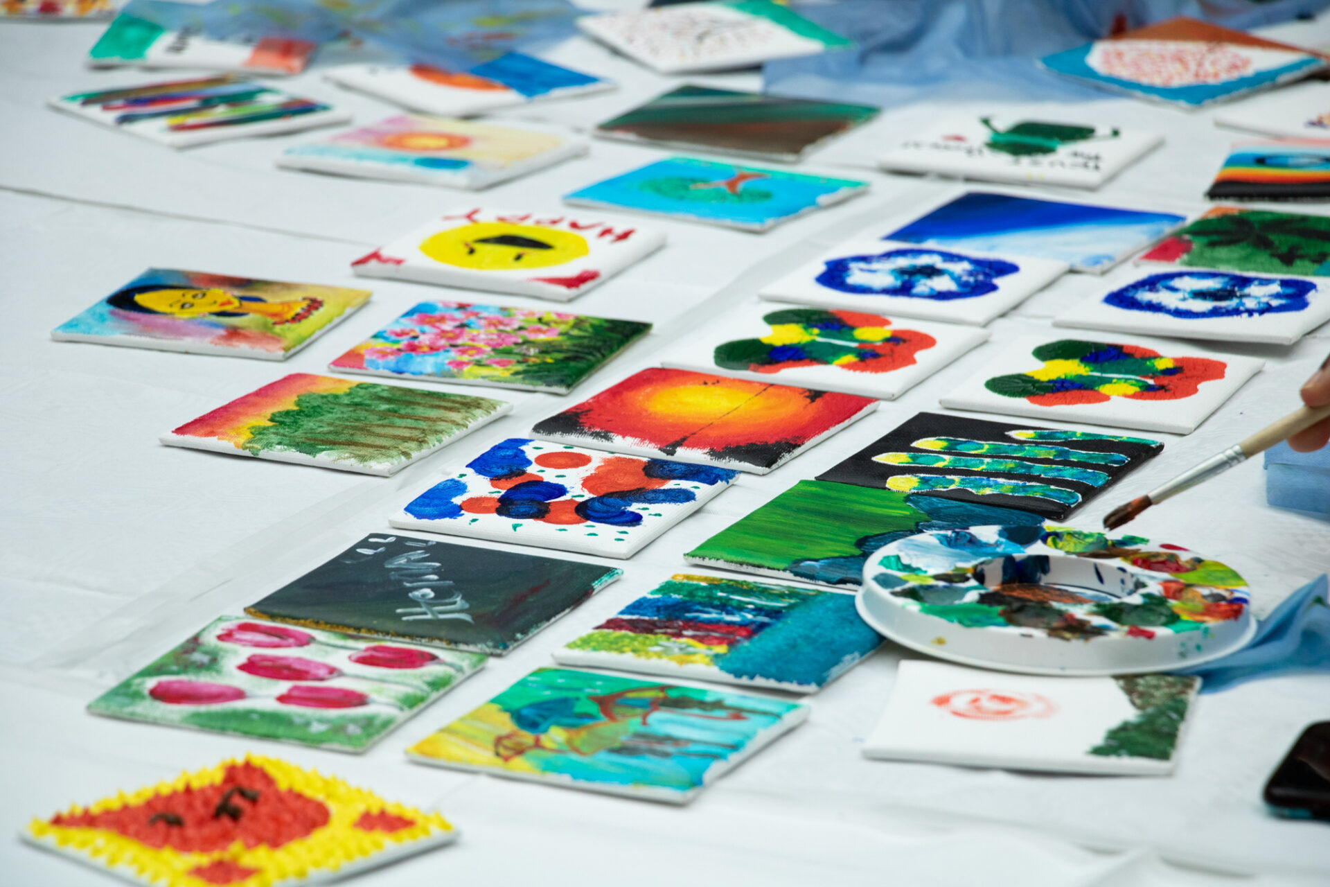 Painted tiles on a table.